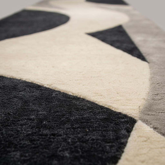 Close-up of hand-tufted wool runner rug showing dense plush cut pile, soft matte fibers, and clean carved edges.