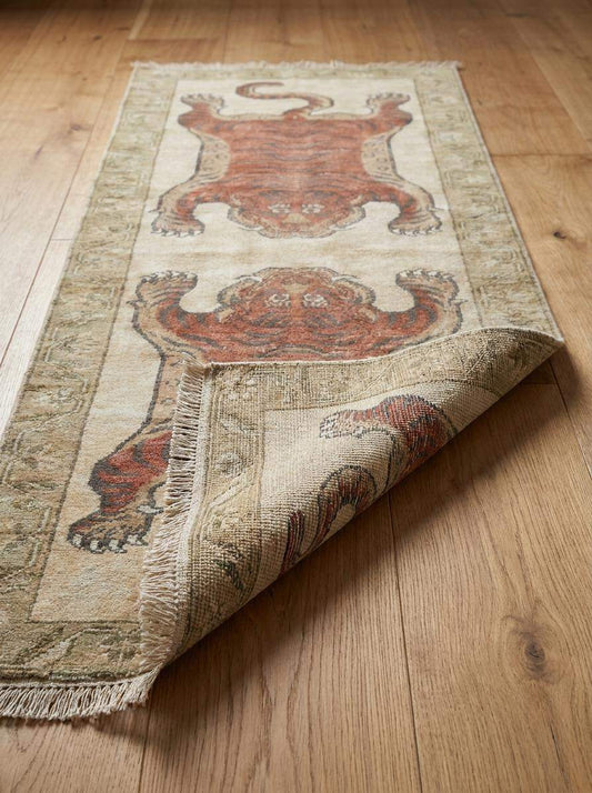 Close-up of hand knotted wool pile showing detailed tiger pattern, artisan knotting, natural wool fibers and low pile texture __etsy:8148345783