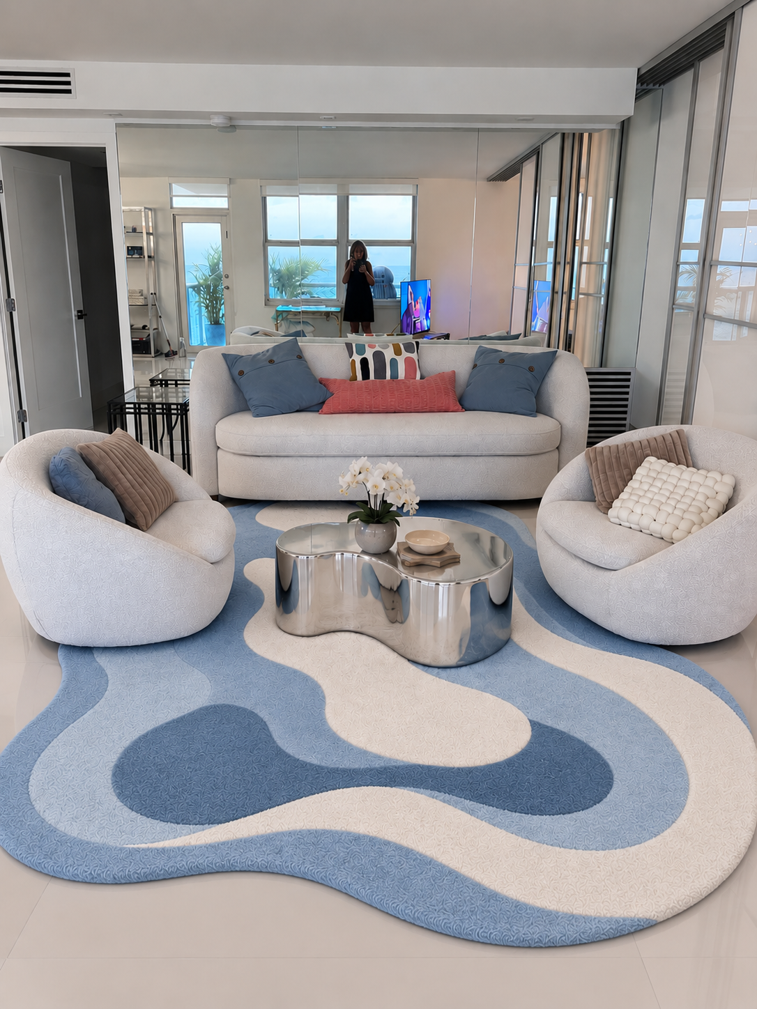 7x7 ft rug in blue and cream, featuring an abstract wavy pattern and soft textured surface