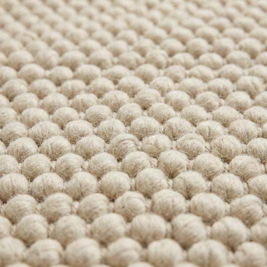 Chunky wool rug with thick cream loop pile, handwoven for cozy modern farmhouse and Scandinavian decor