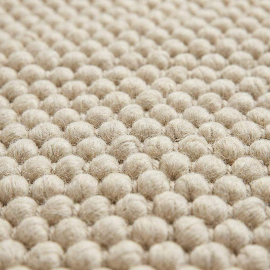 Chunky wool rug with thick cream loop pile, handwoven for cozy modern farmhouse and Scandinavian decor