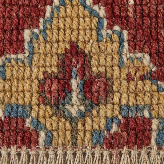 Floral medallion hand knotted wool Indo-Persian style area rug with brick red, ivory, and gold tones