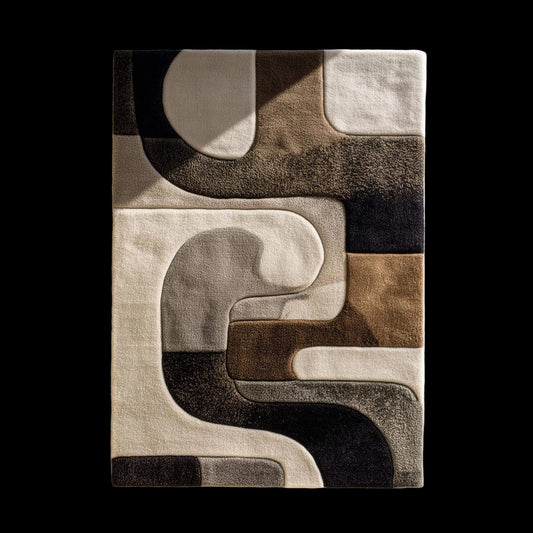 Hand tufted wool rug with abstract black geometric design on ivory background and plush high-low texture