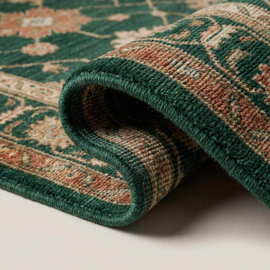 Close-up of hand knotted wool rug showing dense knot structure, soft wool fibers, and detailed floral weaving in green and beige tones __etsy:7958095643