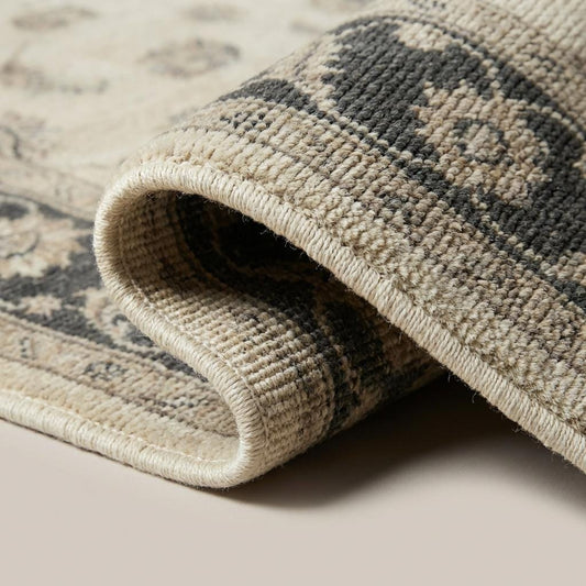 Close-up of hand knotted wool pile showing individual knots and soft natural texture