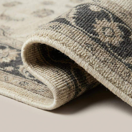 Close-up of hand knotted wool pile showing individual knots and soft natural texture