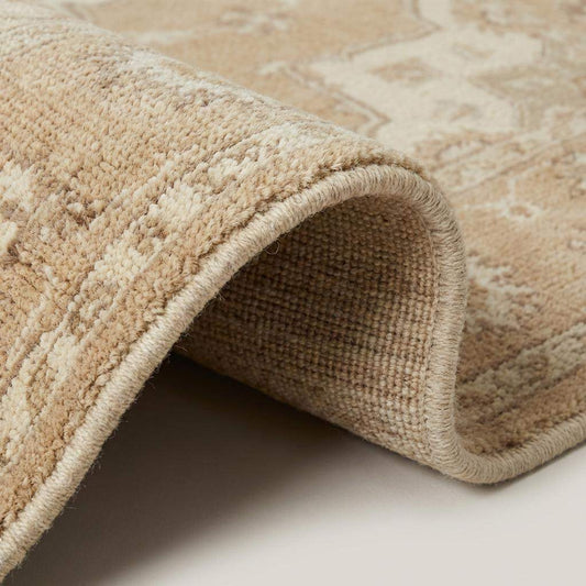 Close up of hand knotted wool pile texture showing individual knots and natural color variations in the beige yarn. __etsy:7693785491