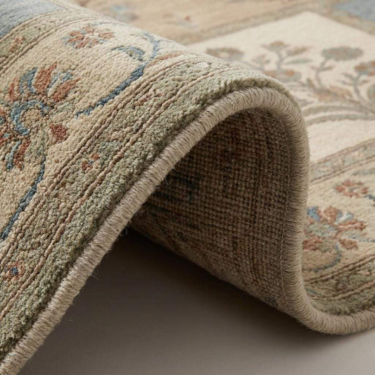 Close-up of hand knotted wool rug showing dense knot structure, soft pile texture, and detailed floral weaving craftsmanship __etsy:7917719040