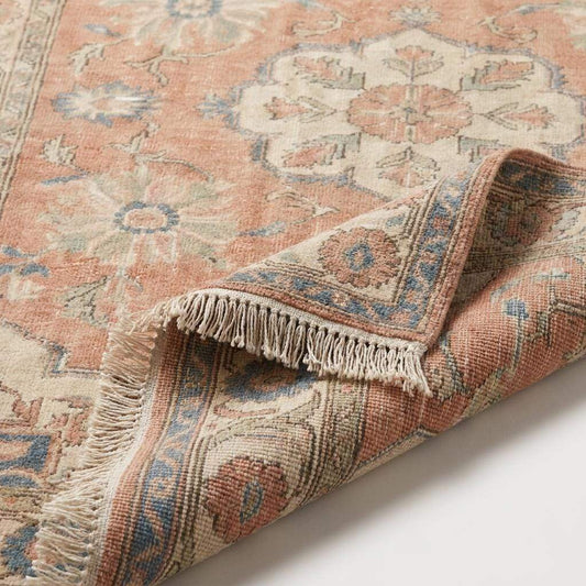 Close-up texture of handmade wool hand-knotted rug showing low pile construction, floral detailing, and artisan weaving craftsmanship __etsy:8099831339