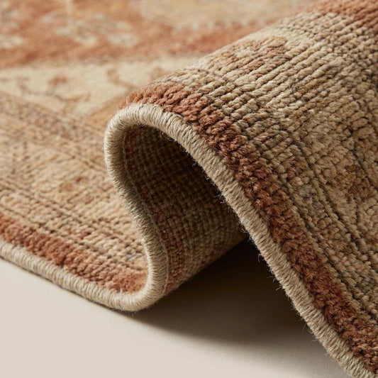 Close up of hand knotted wool pile showing individual knot structure, dense texture and natural fiber detailing in terracotta and cream tones __etsy:7779045203