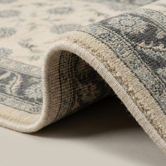 Close-up of hand knotted wool pile showing individual knots and natural fiber texture