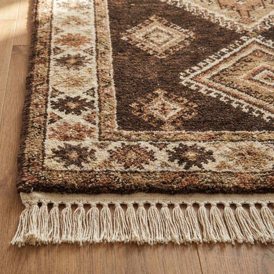 Close-up of hand knotted wool rug showing dense knots, natural wool fibers, and textured pile