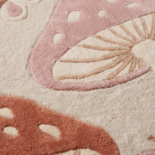 Close-up texture of handmade hand tufted wool rug showing carved pile detailing, soft plush fibers, and raised mushroom pattern __etsy:8036411851