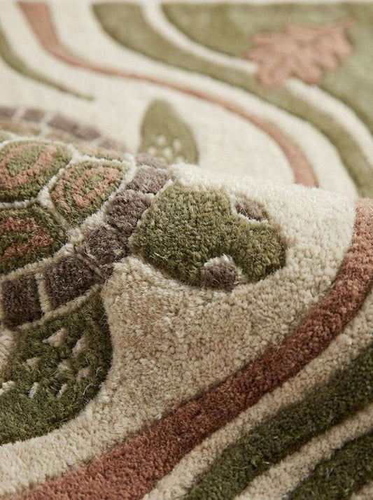 Hand tufted wool turtle area rug with carved high-low texture in coastal living room setting