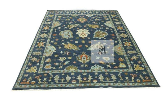 Handmade Oushak wool rug in olive green, beige, and gray with intricate floral Turkish knot design