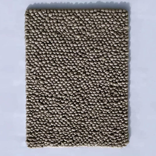Top view of a handmade rectangular taupe felt ball rug with dense small pom-pom texture — chunky wool mat for living room, nursery or entryway.