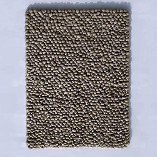 Top view of a handmade rectangular taupe felt ball rug with dense small pom-pom texture — chunky wool mat for living room, nursery or entryway.