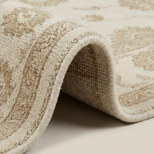 Close up of hand knotted wool pile showing individual knots and natural fiber texture