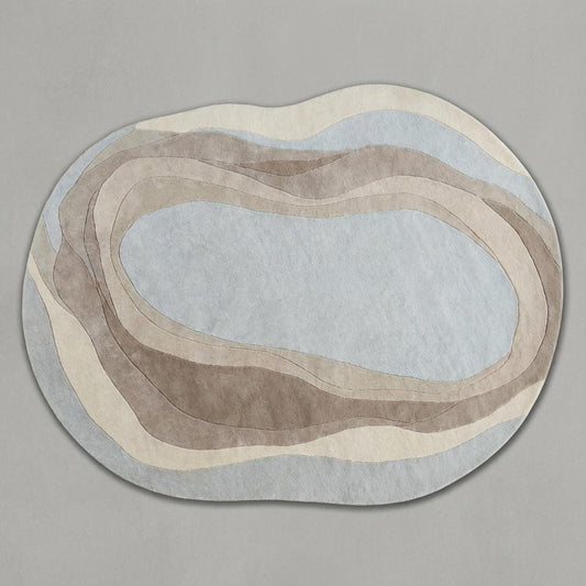 Beige cream organic wavy rug with irregular shape and soft texture for modern minimalist decor