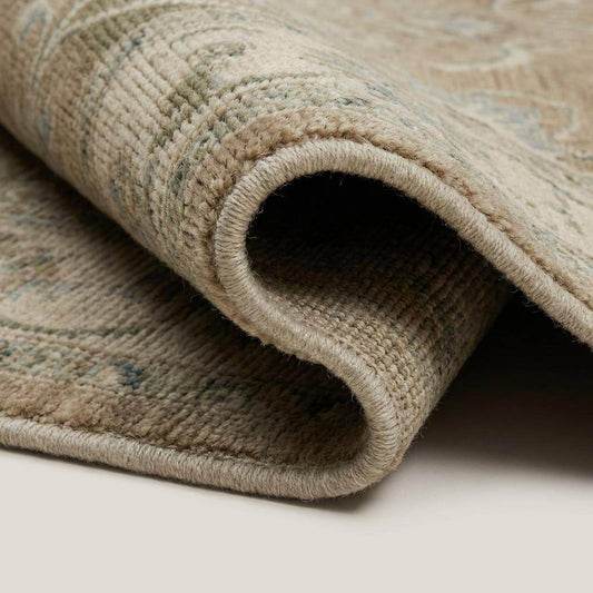 Hand-knotted Oushak floral wool area rug with vintage-inspired muted beige and sage-blue tones