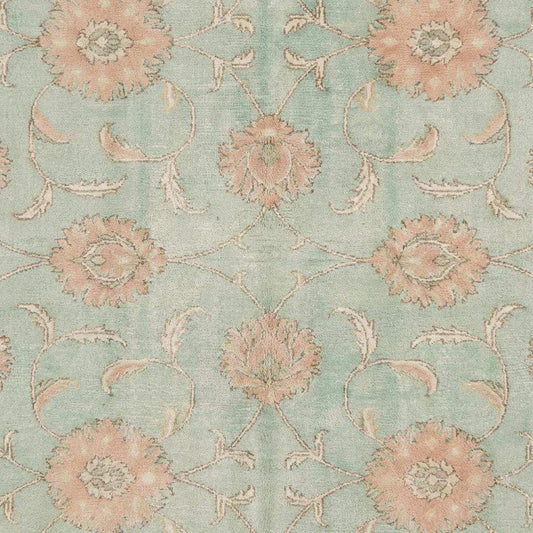 Close-up of hand knotted wool pile showing natural fiber texture, tight knot structure, and soft matte finish typical of authentic Oushak rugs.