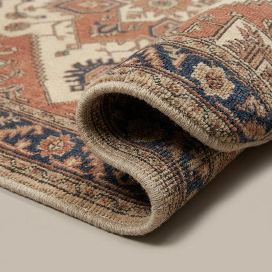 Close-up of hand knotted wool rug showing dense pile, individual knots, and natural wool fiber texture