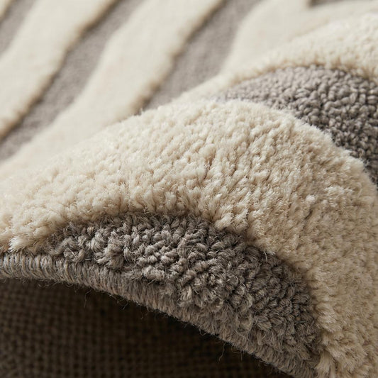 Hand tufted wool modern abstract zebra pattern area rug with high-low carved texture in neutral tones