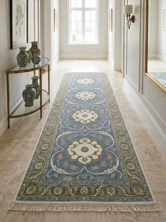 Hand Knotted Oushak Runner Rug in light blue wool, with ivory floral medallions, olive green vine border and fringe.