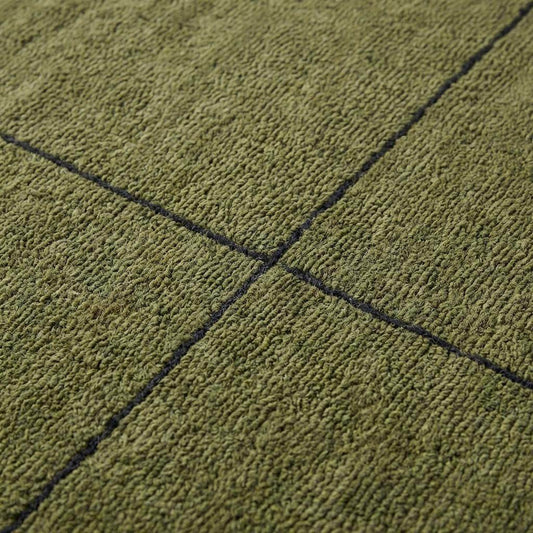 Close-up of hand tufted wool rug texture showing dense olive green pile with carved charcoal grid lines and soft loop surface detail __etsy:7728060922