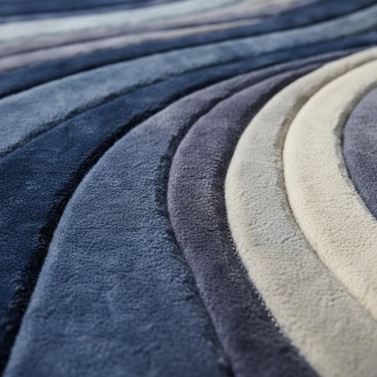 Mid Century Modern Rug with blue sculpted wave pattern and plush textured surface