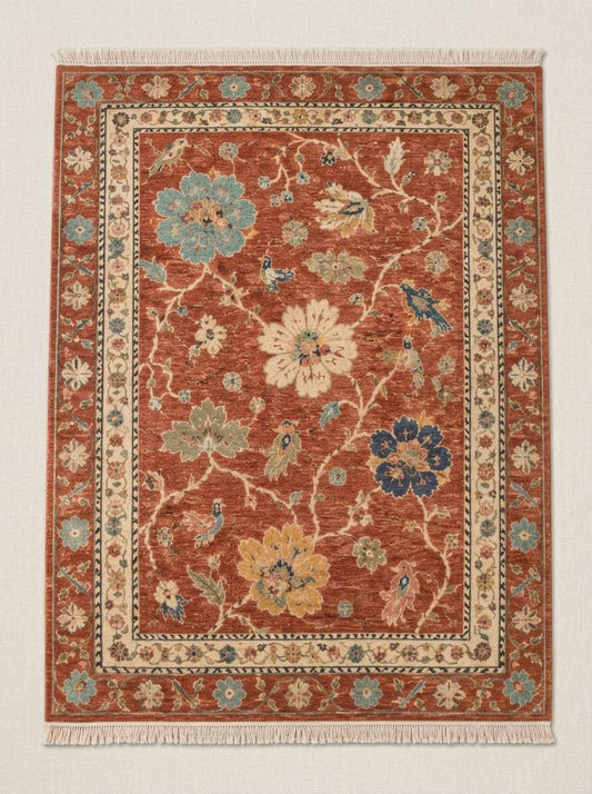 Oushak Hand Knotted Rug in terracotta wool with multicolour floral vines, small birds, ivory rosette border and fringe