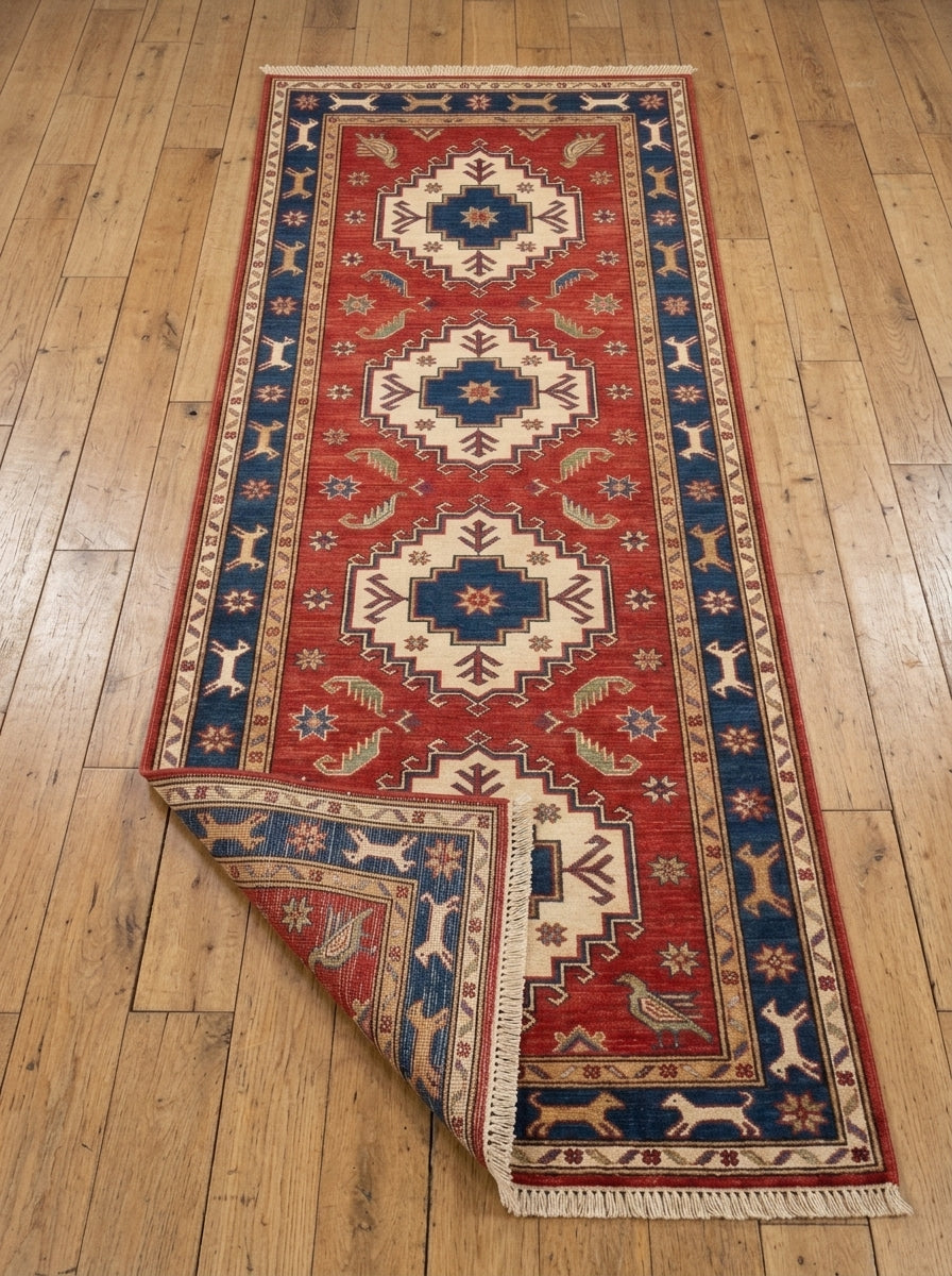 Hand Knotted Oushak Runner Rug in red wool with ivory stepped medallions, navy star centers, animal border and fringe.