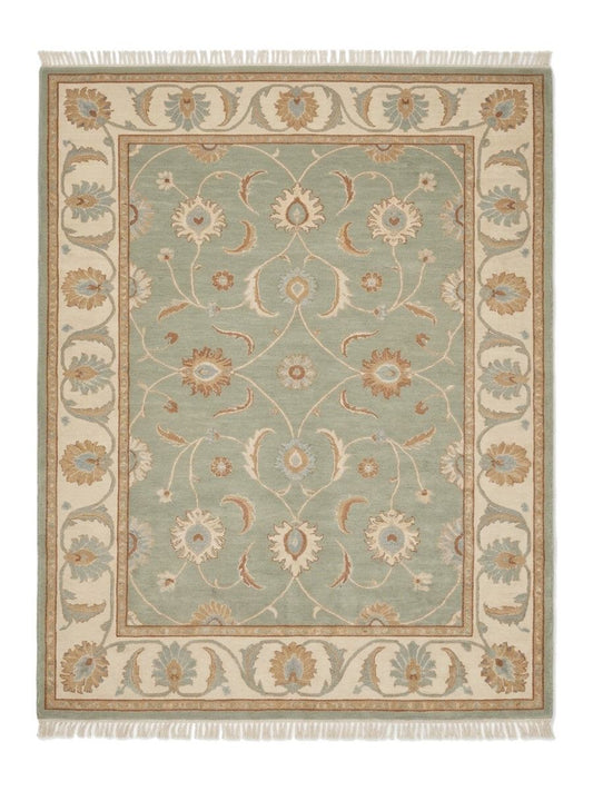 Sage Green Oushak Rug in muted sage wool with ivory floral vines, camel and blue motifs, wide ivory border and fringe