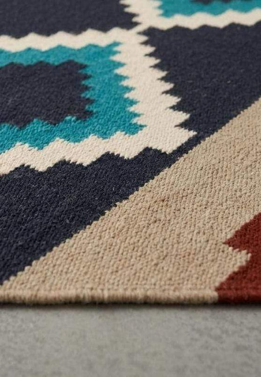 Southwestern flatweave wool rug with terracotta, turquoise, and geometric diamond design for living room decor