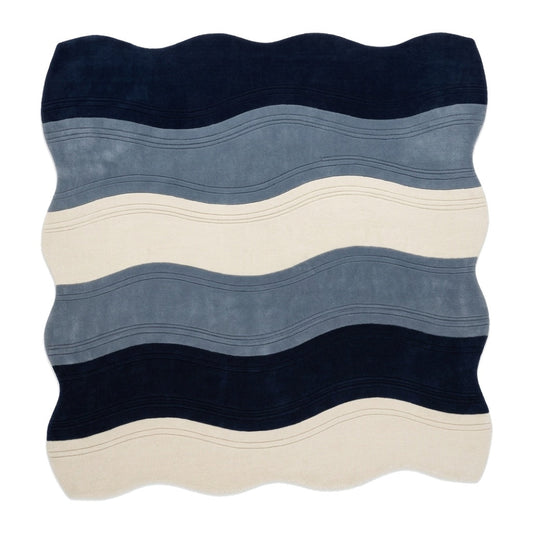 Wavy Rug with an irregular edge, featuring plush wool bands of navy, slate blue and ivory with fine carved lines