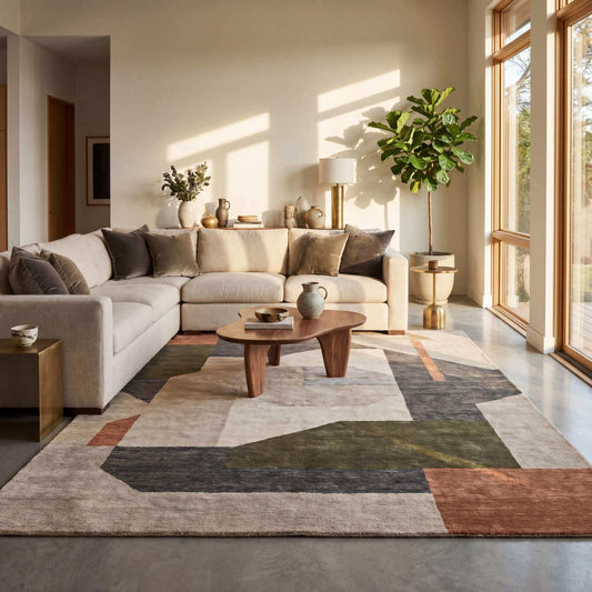 Modern living room showcasing the best rug colors for 2026 including beige, grey, green, terracotta, ivory, and navy blue rugs