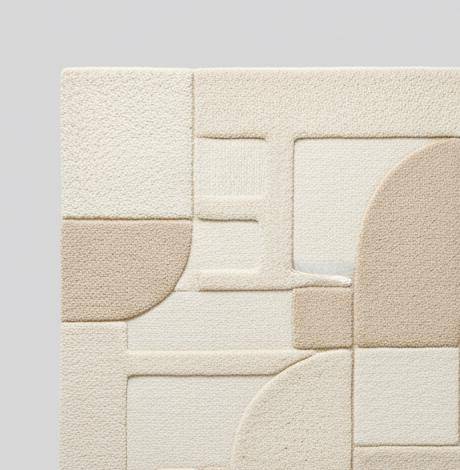3D textured geometric area rug in beige and cream tones with carved design for modern home décor