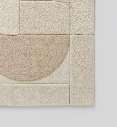 3D textured geometric area rug in beige and cream with carved design for modern home decor