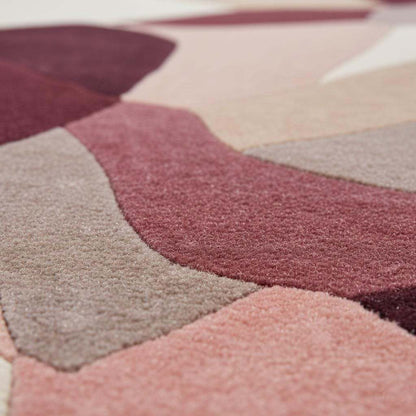 Abstract area rug in burgundy blush mauve geometric design for modern living rooms