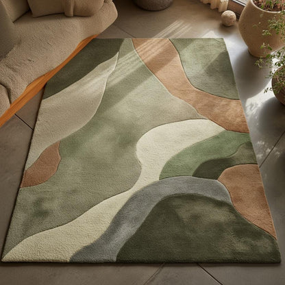 Sculpted area rug with abstract earth tones and high-low handmade wool texture