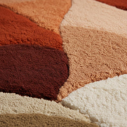 Abstract shag rug with irregular organic edges in terracotta and earthy tones for boho living room decor