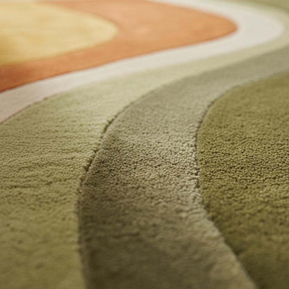 Hand tufted abstract wool rug with retro geometric pattern and organic curves in warm earthy tones