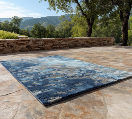 Modern handmade tufted blue and gray wool rug with abstract floral design, 6x9 area size, handcrafted for elegant home decor