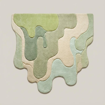 Modern irregular shape tufted rug featuring flowing abstract design in green and beige, aesthetic statement carpet for contemporary interiors