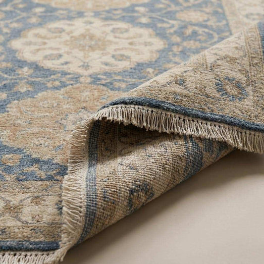 Close-up of handmade wool pile showing hand-knotted construction, low pile texture, and detailed floral weaving __etsy:8062272816