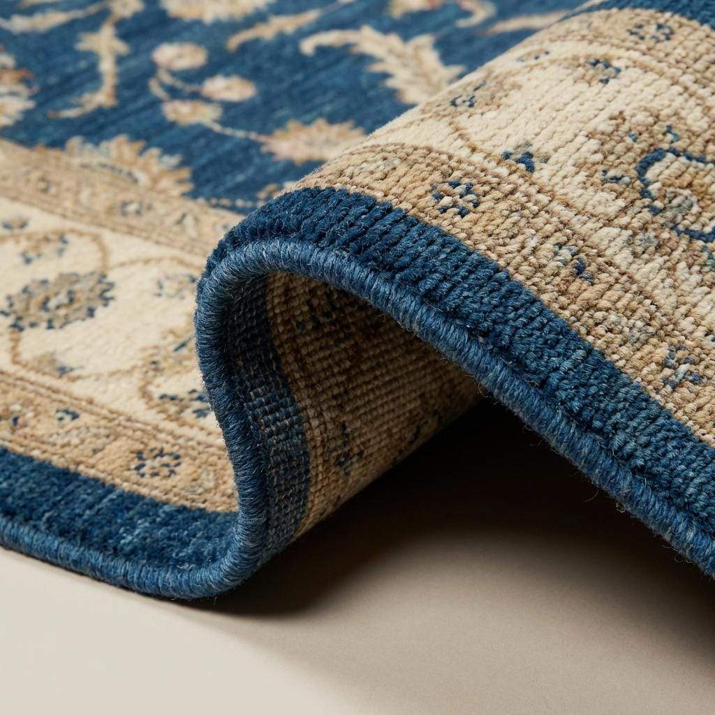 Blue Oushak hand knotted wool area rug with traditional floral design and natural wool fringe