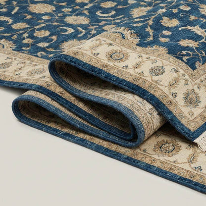 Blue Oushak hand knotted wool rug with traditional floral design