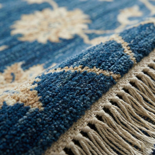 Close-up of hand knotted wool pile showing dense knots and natural wool texture