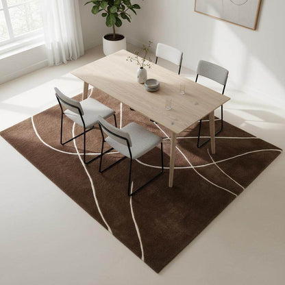 Brown abstract rug with hand tufted curved white lines on rich brown background for modern living spaces