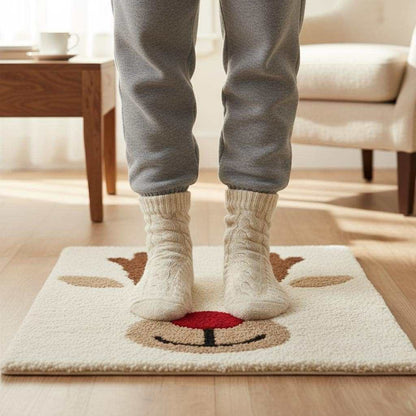Cozy hand-tufted Christmas reindeer rug with Rudolph face and red nose for festive living room decor